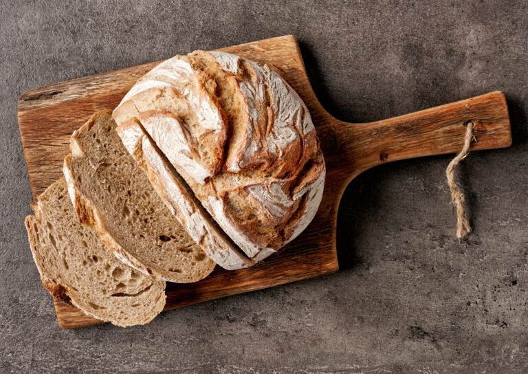 freshly baked bread on dark gray kitchen table, top view